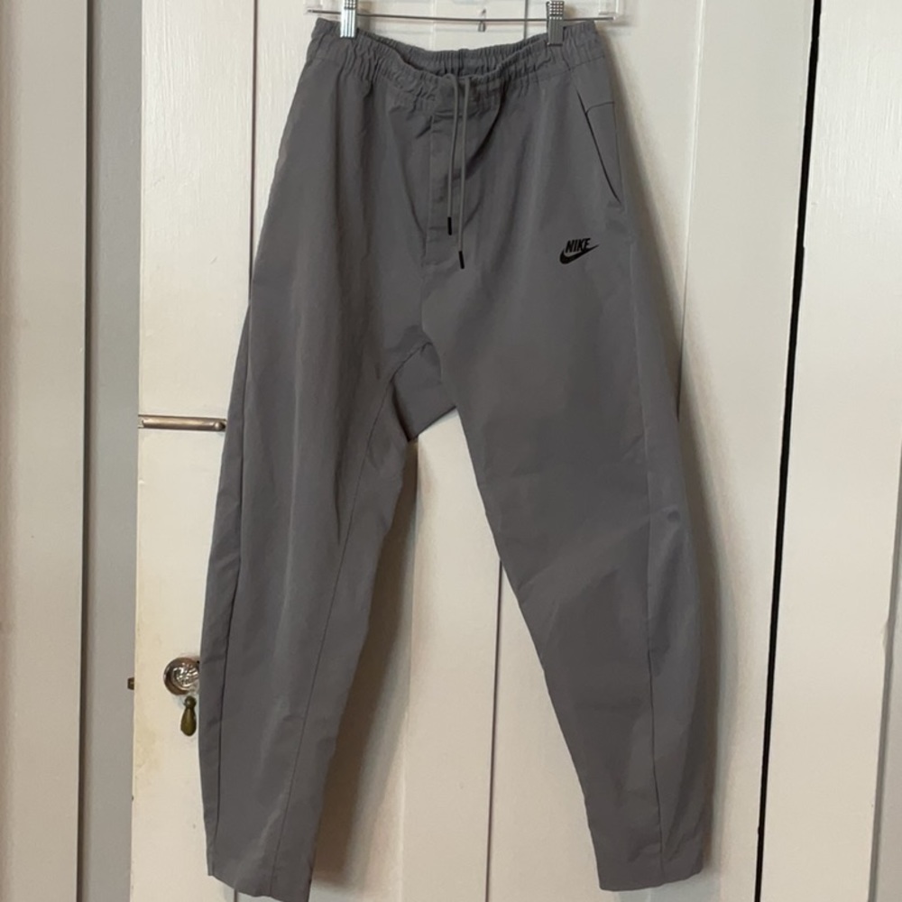 Large, gray, men’s Nike athletic lifestyle pants